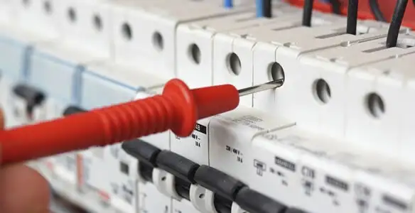 Electrical contractor testing circuit breakers during electrical repair in Plattsmouth, NE