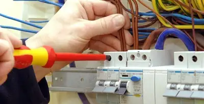 electrician services performing professional electrical panel wiring and connections in Bellevue, NE