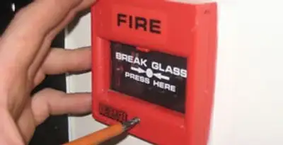fire alarm installation service showing manual fire alarm pull station installed by licensed electricians in Bellevue, NE