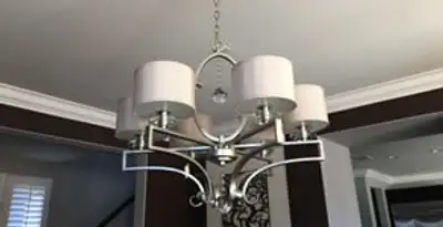 Modern chandelier installation with multiple light fixtures in Bellevue, NE