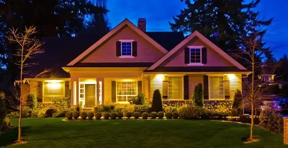 security light installation services illuminating a residential exterior at night in Bellevue, NE