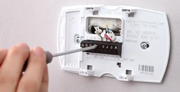 Thermostat installation service with proper wiring and secure wall mounting in Bellevue, NE